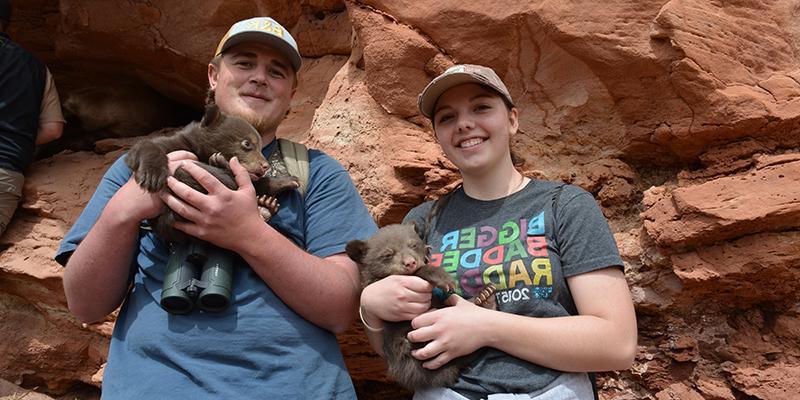 Students with bear cubs